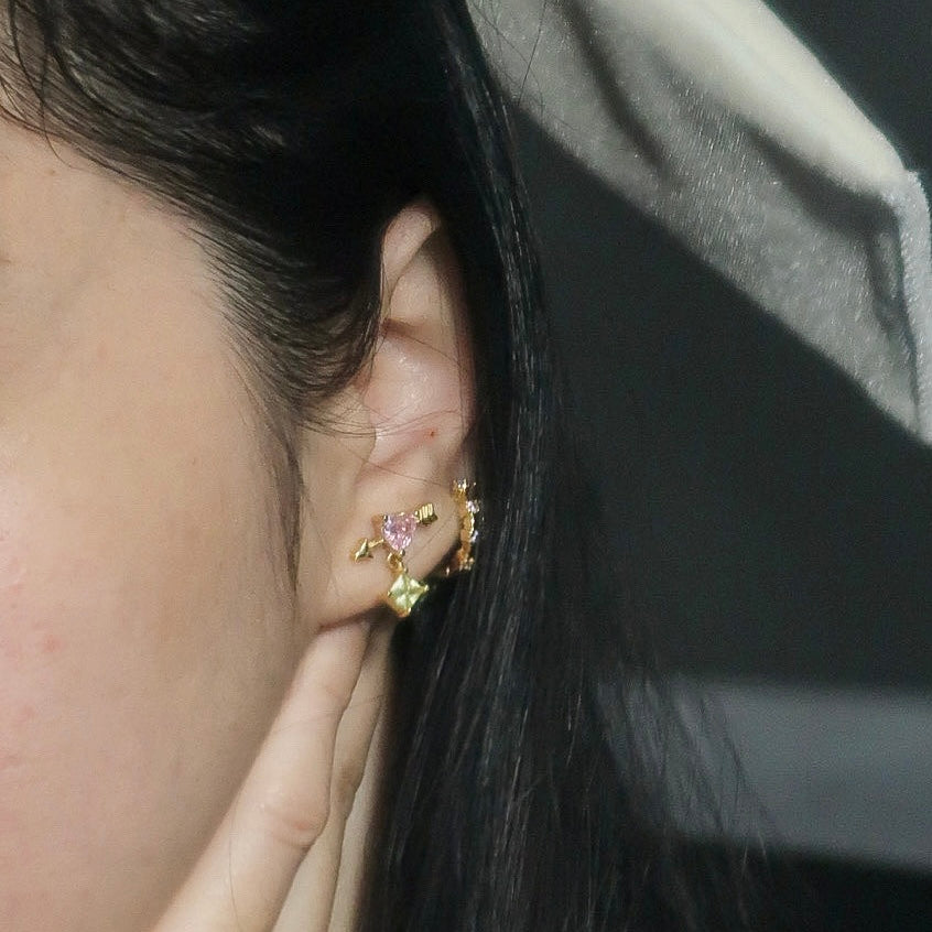 Heart cupid stud earrings.